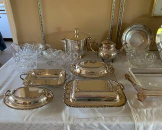 Silverplate serving pieces that were stored in felt bags and kept in mint condition.