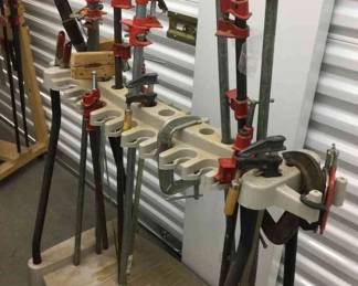 Rack Of Clamps On A Suncast Rolling Plastic Cart