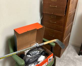 Antique wood filing cabinet, Bauer ice skates & Easton Hockey Stick