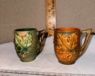 Set of 4 Roseville Mugs, the brown one has a handle repair, see next photo of the other two mugs $100.00