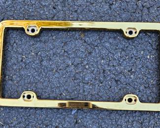 Gold tone license plate cover