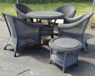 Polyvinyl Woven Patio Set Including Round Table, 31" x 38" Diameter With Glass Top, Round Back Chairs, Qty 4, 1 Missing Seat Cushion, And Side Table, 19" x 24" Diameter