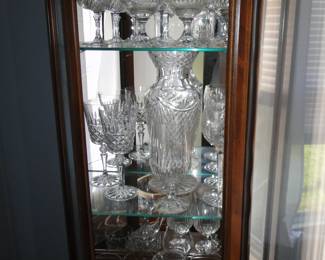 Curio filled with Waterford and Shannon Crystal