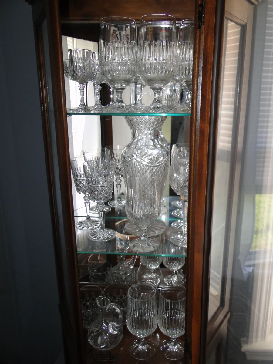 Curio filled with Waterford and Shannon Crystal