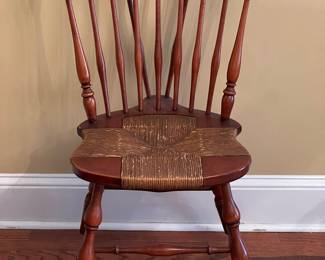One of two vintage Windsor-style chairs