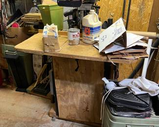 A shop full of fun! Tools, wood and scrap materials. Paint and oil.