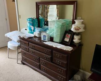 Dresser with mirror; medical supplies