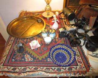 Small Heriz carpet with treasures on top