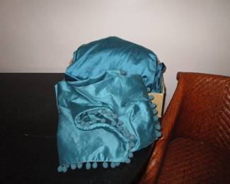 Teal velvet drape panels and matching pillow shams