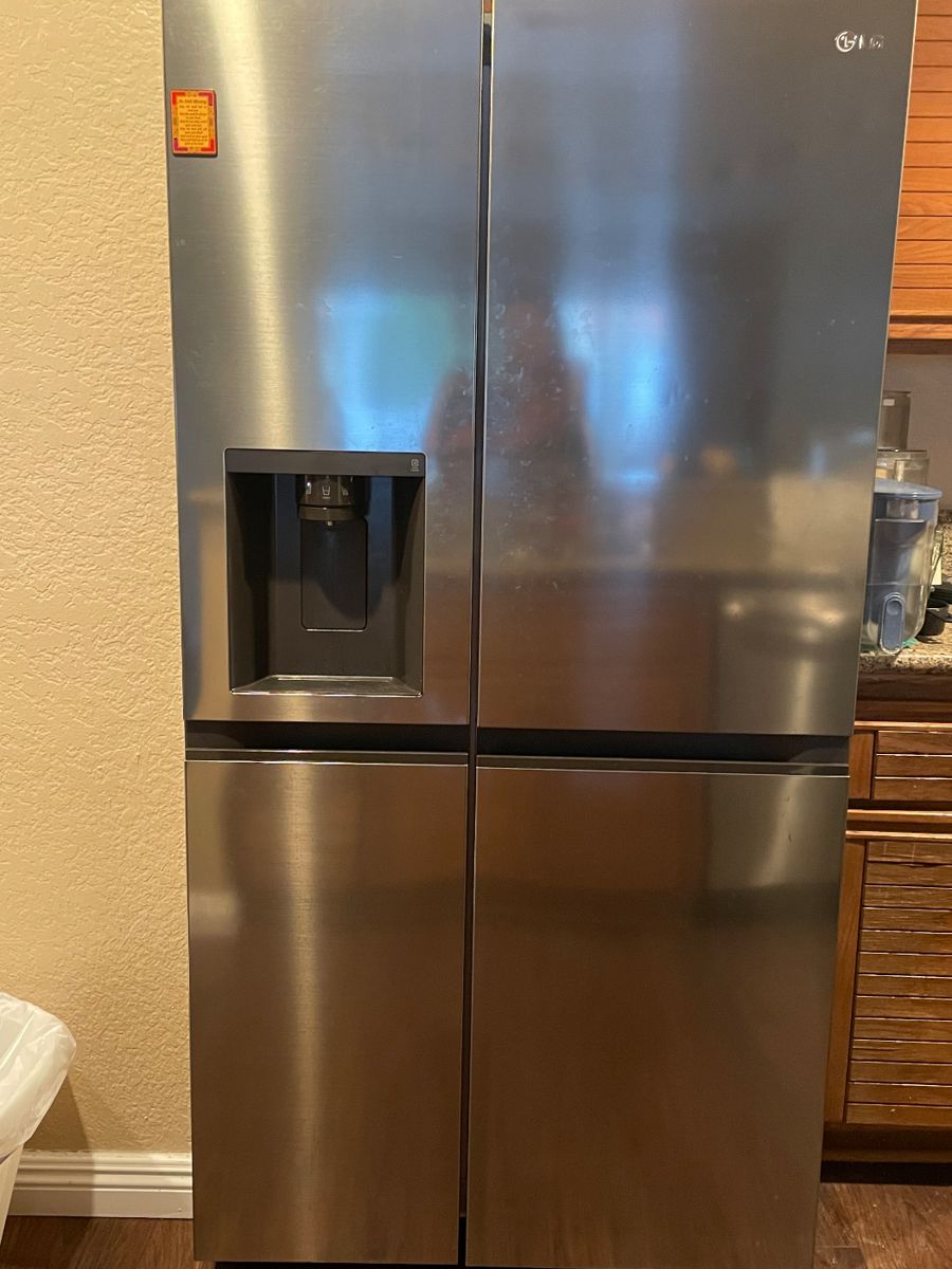 3 month old LG stainless steel side by side refrigerator/freezer with external ice/water dispenser; still with warranty