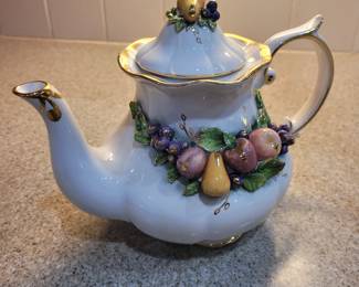 Three dimensional teapot with fruit.