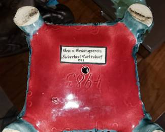 On bottom of piece. Circa 1904