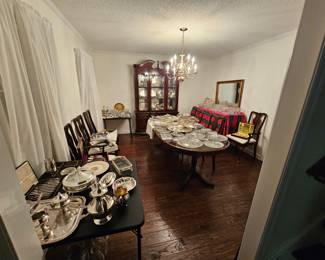 Formal dining table with 6 chairs and china cabinet, various silver pieces, multiple sets of silver flatware, various pieces of crystal 