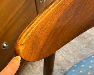 1 chair has a gouge