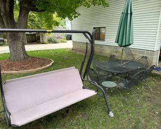 Metal patio set. Swing has cushions. And is comfy!!
