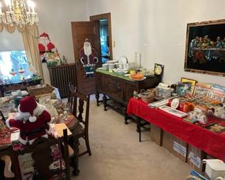 Yes, it's a velvet last supper painting. Antique sideboard and dinning set. More knick knacks. Talking Santa story time. 