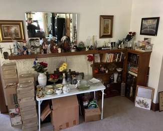 More religious figurines. Glass centerpieces. Book shelves. 