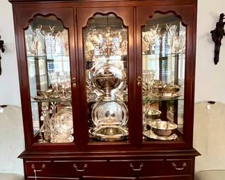 Cabinet is stuffed with silver and silver plated serving pieces- perfect timing for holiday entertainment