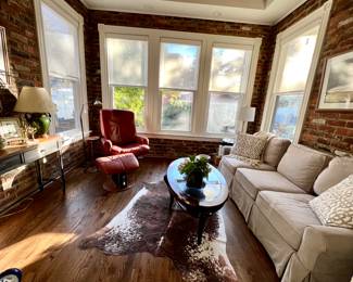 Faux hide rug, slipcovered sofa!, MCM leather chair and ottoman, console, MAPS, and more