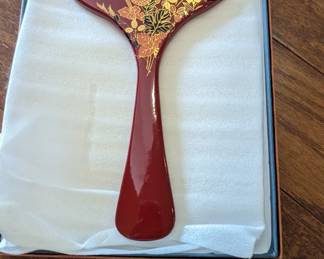 Lacquered hand mirror