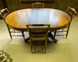 Oval table set with caned seats 