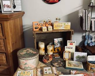 Large Selection of Decor on Restoration Hardware Table.