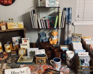 Large Selection of Decor on Restoration Hardware Table.