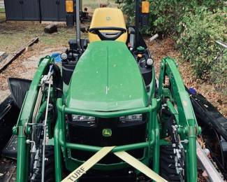 John Deere 1025-R Sub-Compact Utility Tractor with 60D Autoconnect Mid Mount Side Discharge Mower, Rear Mount Box Blade, Fixed Ting Pallet Loader and 120-R Front End Loader. 16 FT Bumper Pull Flatbed Trailer.