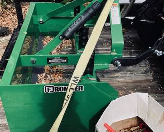 John Deere 1025-R Sub-Compact Utility Tractor with 60D Autoconnect Mid Mount Side Discharge Mower, Rear Mount Box Blade, Fixed Ting Pallet Loader and 120-R Front End Loader. 16 FT Bumper Pull Flatbed Trailer.