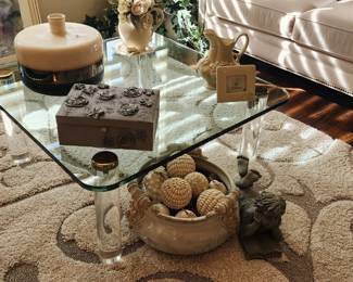 Gorgeous glass coffee table and lovely accent rug