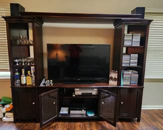 Entertainment center breaks down to 4 seperate pieces, use as book shelves, tv stand separately or together as seen here