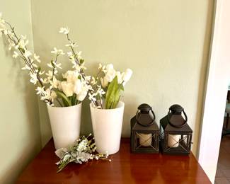 Candle lanterns and large glass vases