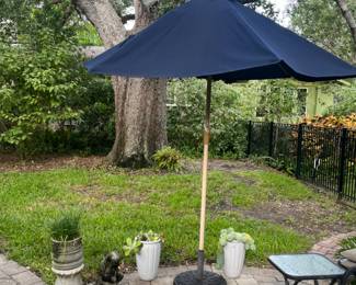 Umbrella, plants, and outdoor decor