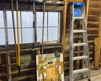 Long handled tools and ladder