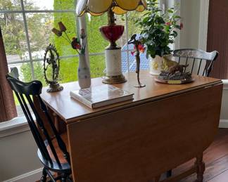 Drop leaf table with chairs.  One of several.