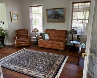   leather couches antique lamps