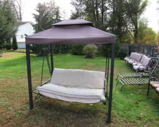 Beatiful canopied swing.   Swing comes right off and frame can be dismantled or put on truck easily.