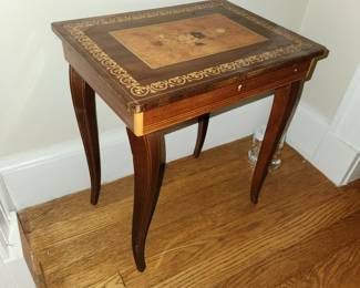 Small, decorative table-music box