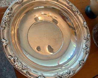 Sterling serving bowl--reflection of chandelier