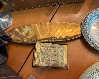 Close up of 2 Tiffany desk pieces, pen holder & paper clip in Nautilus pattern