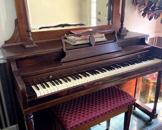 We have an upright piano and the mirrored shelf is separate.