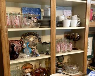 Cabinets are stuffed with beautiful dishes, glassware, serving pieces.