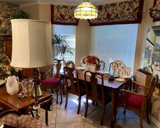 This maple dining table has 6 chairs, 2 more leaves and pads.