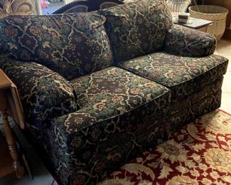 This is a beautiful navy fabric loveseat.