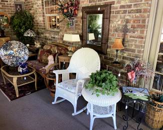 The sunroom is packed with beautiful wicker and rattan furniture!