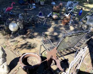 We have an incredible outdoor space full of concrete, metal and clay items.