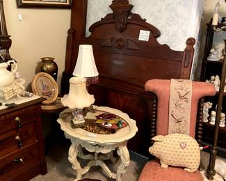 Rooms full of carved antique furnishings,  including a full bed, 3 twin head boards, dressers, side chairs, tables.