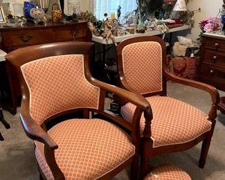 Awesome wooden arm chairs in matching fabric.