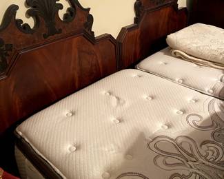 This pair of twin headboards and mattress sets (like new) are put together for a king size bed.