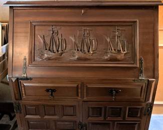 Antique drop front desk with carved ships motif
